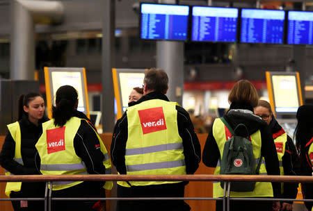 Members of German union Verdi demonstrate at the Helmut Schmidt airport during a strike of security personnel demanding higher wages in Hamburg, Germany, January 15, 2019. REUTERS/Fabian Bimmer