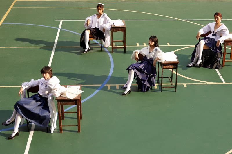 Models pose for an advertising campaign wearing Thai designer Tin Tunsopon's creations aiming to be an alternative to the school uniforms that are mandatory in the country