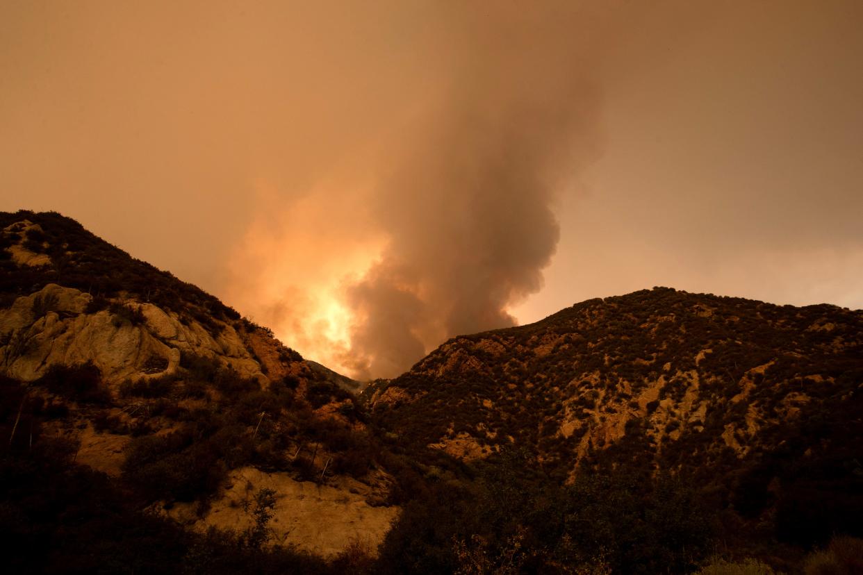 Smoke from the Line Fire is visible from Highway 38 near Mountain Home Village, Calif., on Monday, Sept. 9, 2024.