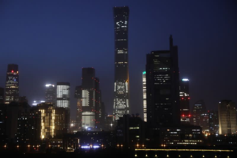 Buildings in the Central Business District (CBD) are seen lit up during the night in Beijing