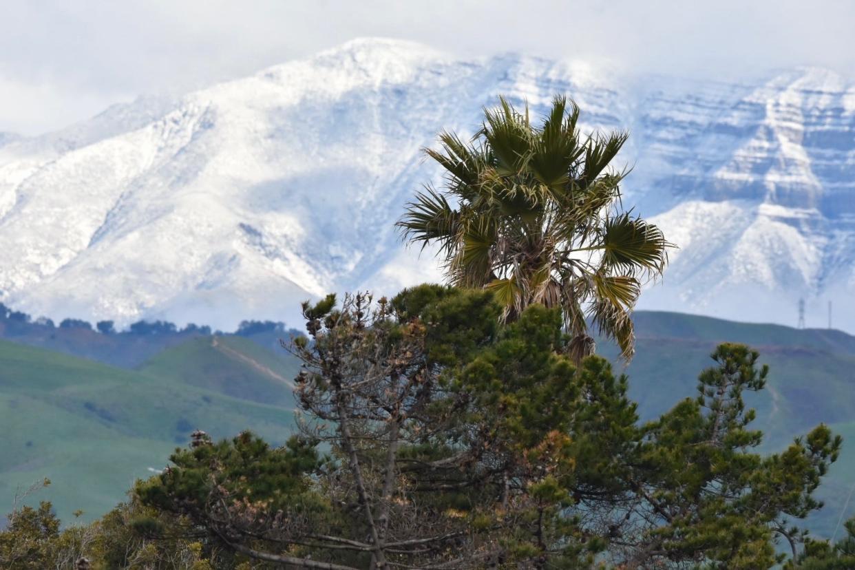 Snow lightens the Topa Topa Mountains on Jan. 30. More snow in high elevations is forecast this week.