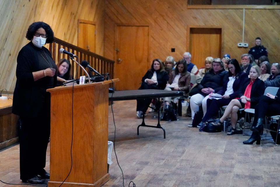 Retired Jackson, Miss., public schools educator Etta Smith, left, addresses an audience attending the Mississippi Department of Education public comment hearing about proposed revisions to the state's academic standards for social studies, Friday, Jan. 28, 2022, at the Mississippi Agricultural Museum in Jackson, Miss. (AP Photo/Rogelio V. Solis)