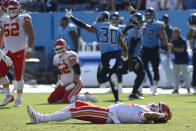 Kansas City Chiefs quarterback Patrick Mahomes lies on the field after being hit in the second half of an NFL football game against the Tennessee Titans Sunday, Oct. 24, 2021, in Nashville, Tenn. (AP Photo/Mark Zaleski)