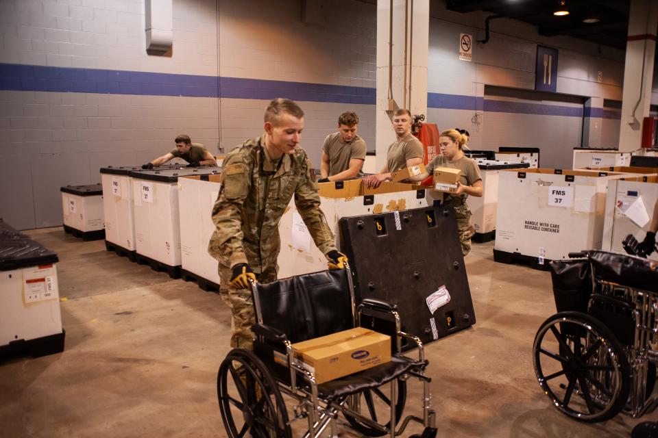 Members of the Illinois Air National Guard assemble medical equipment at the McCormick Place Convention Center in response to the COVID-19 pandemic in Chicago on March 30, 2020.