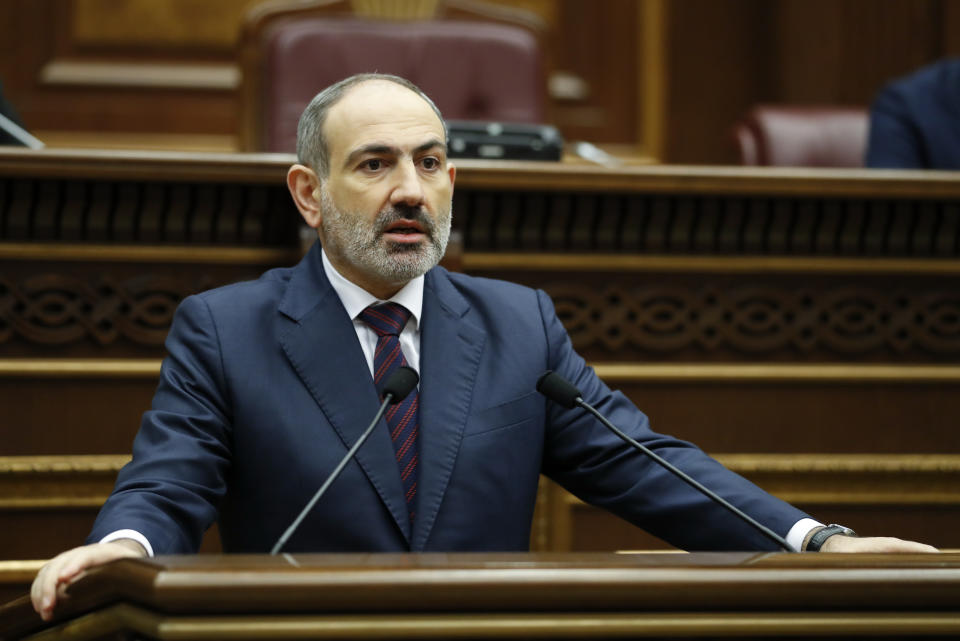 In this photo provided by the Armenian Prime Minister Press Service via PAN Photo, Armenian Prime Minister Nikol Pashinian answers to questions during his meeting with members of the National Assembly in Yerevan, Armenia, Monday, Nov. 16, 2020. (Tigran Mehrabyan, Armenian Prime Minister Press Service/PAN Photo via AP)