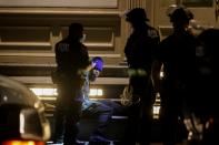 A looter is detained by police officers amid nationwide unrest following the death in Minneapolis police custody of George Floyd, in the Soho district of Manhattan, New York City