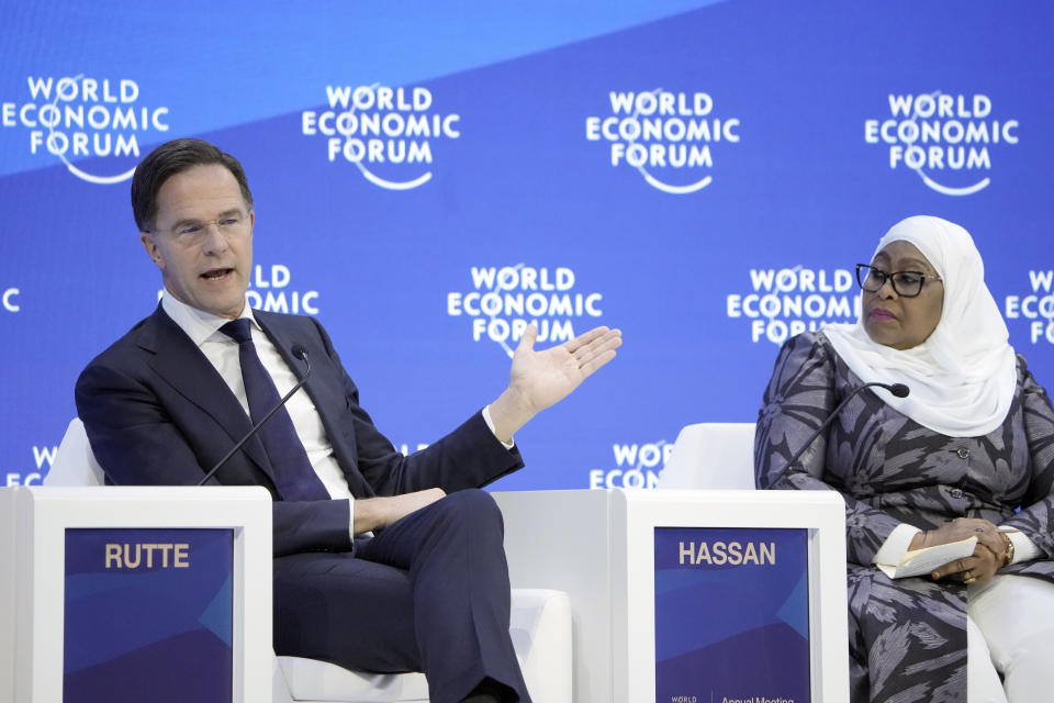 Prime Minister of the Netherlands Mark Rutte, left, speaks beside President of Tanzania Samia Suluhu Hassan, right, at the World Economic Forum in Davos, Switzerland Thursday, Jan. 19, 2023. The annual meeting of the World Economic Forum is taking place in Davos from Jan. 16 until Jan. 20, 2023. (AP Photo/Markus Schreiber)