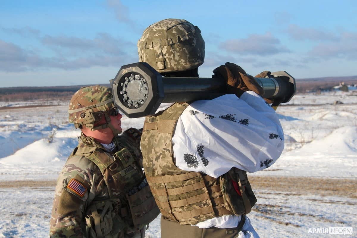 A US army instructor training a Ukrainian service member to operate a M141 grenade launcher at a shooting range in Lviv (REUTERS)