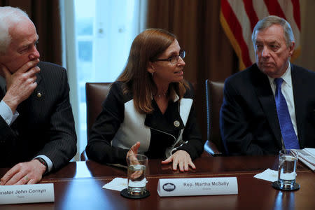 FILE PHOTO - U.S. Representative Martha McSally (R-AZ), flanked by Senator John Cornyn (R-TX) and Senator Dick Durbin (D-IL), speaks as U.S. President Donald Trump holds a bipartisan meeting with legislators on immigration reform at the White House in Washington, U.S. January 9, 2018. REUTERS/Jonathan Ernst