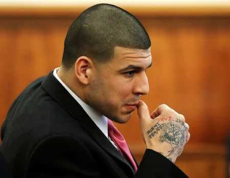 FILE PHOTO: Former New England Patriots football player Aaron Hernandez sits during his murder trial at Bristol County Superior Court in Fall River, Massachusetts, U.S. on April 2, 2015. REUTERS/Steven Senne/Pool/File Photo