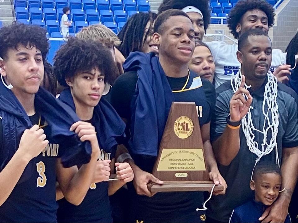 Stony Point players Junior Goodlet, Uzziah Buntyn and Josiah Moseley along with head coach Antoine Thompson celebrate the Tigers' Region IV-6A championship Saturday over San Antonio O'Connor. The Tigers along with Class 2A Thrall will represent the Austin area at this week's UIL state tournament.