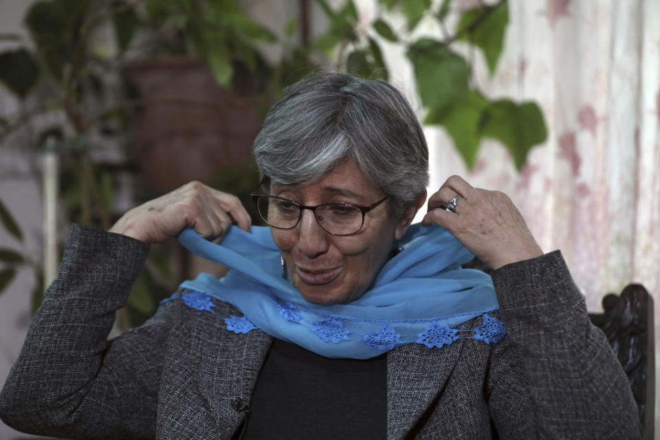 Sima Samar, a prominent activist and physician, who has been fighting for women’s rights in Afghanistan for the past 40 years, adjusts her scarf during an interview with The Associated Press, in Kabul, Afghanistan, Saturday, March 6, 2021. Samar believes her struggle is far from over -- especially at a time when violence is on the rise, peace talks between rival Afghan groups are stuck and the U.S. mulls its departure. (AP Photo/Rahmat Gul)