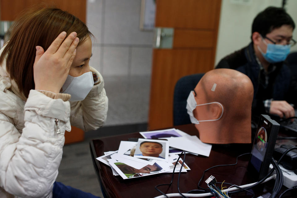 A software engineer tests a facial recognition program that identifies people when they wear a face mask at the development lab of the Chinese electronics manufacturer Hanwang (Hanvon) Technology in Beijing as the country is hit by an outbreak of the novel coronavirus (COVID-19), China, March 6, 2020. Picture taken March 6, 2020.  REUTERS/Thomas Peter