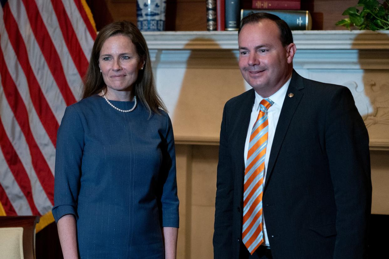 Senator Mike Lee, right, with Supreme Court Justice Amy Coney Barrett at the White House in September. (Getty Images)