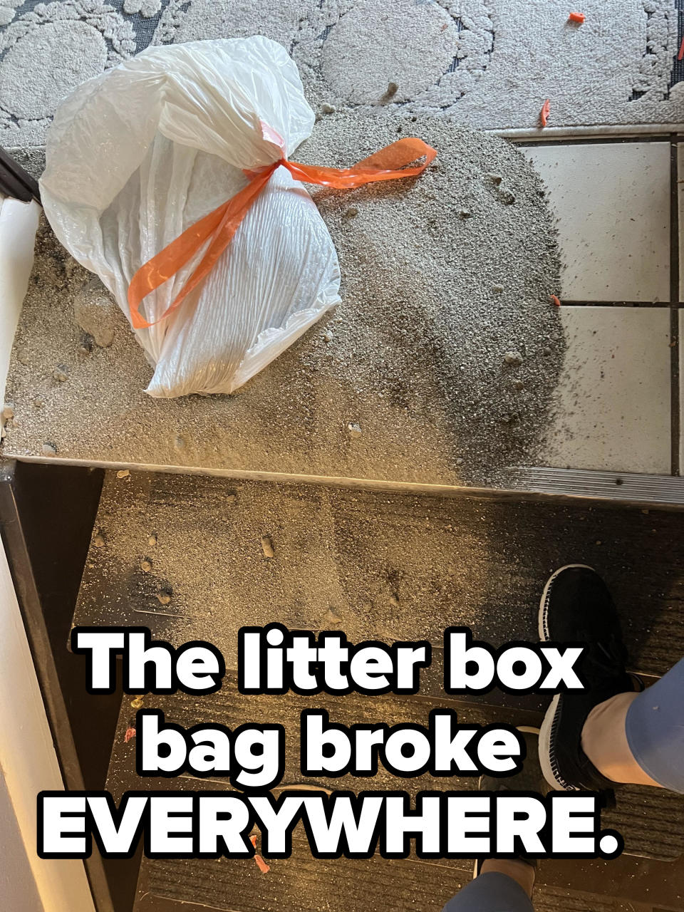 A flight of stairs with sand all over it, with the caption "The litter box bag broke EVERYWHERE"