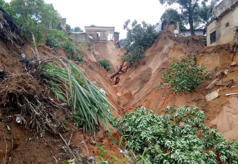 A damaged house is seen after heavy rains caused floods and landslides, on the outskirts of Kinshasa,