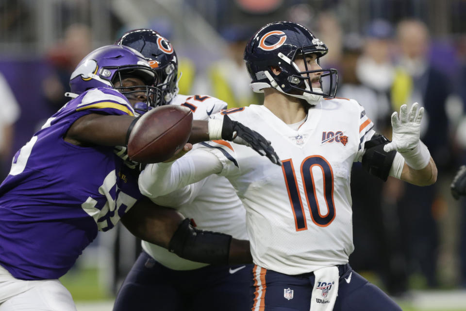 Chicago Bears quarterback Mitchell Trubisky (10) fumbles as he is hit by Minnesota Vikings defensive end Ifeadi Odenigbo, left, during the second half of an NFL football game, Sunday, Dec. 29, 2019, in Minneapolis. Odenigbo recovered the fumble. (AP Photo/Andy Clayton-King)