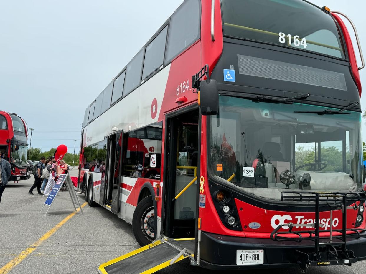 Saturday's OC Transpo job fair at the Greenboro park-and-ride allowed people to do a practice interview on one of the agency's buses.  (Maxim Allain/Radio-Canada - image credit)