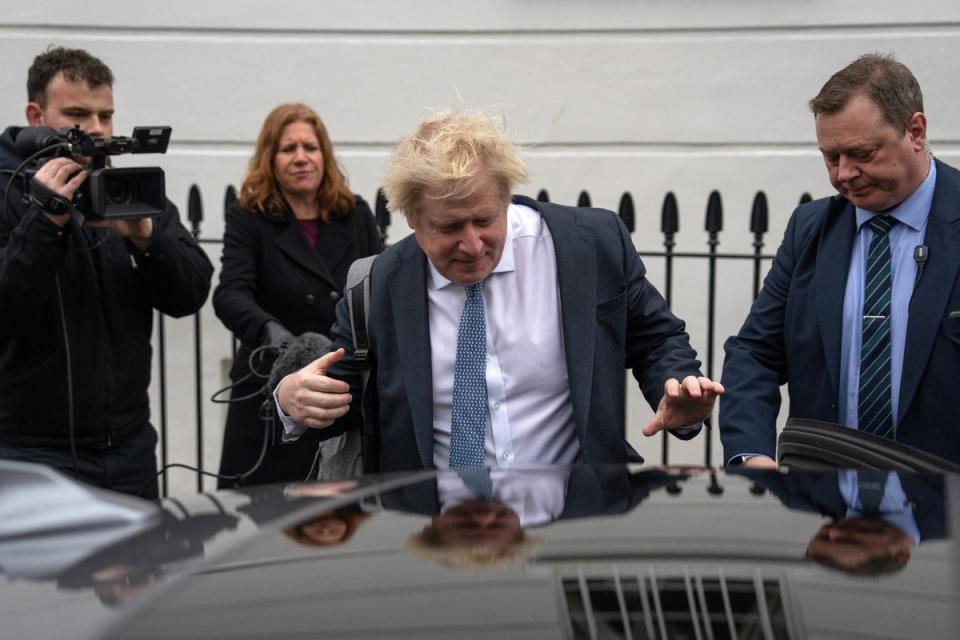 Former British prime minister Boris Johnson gets in an official car as he leaves his home earlier. (Getty Images)