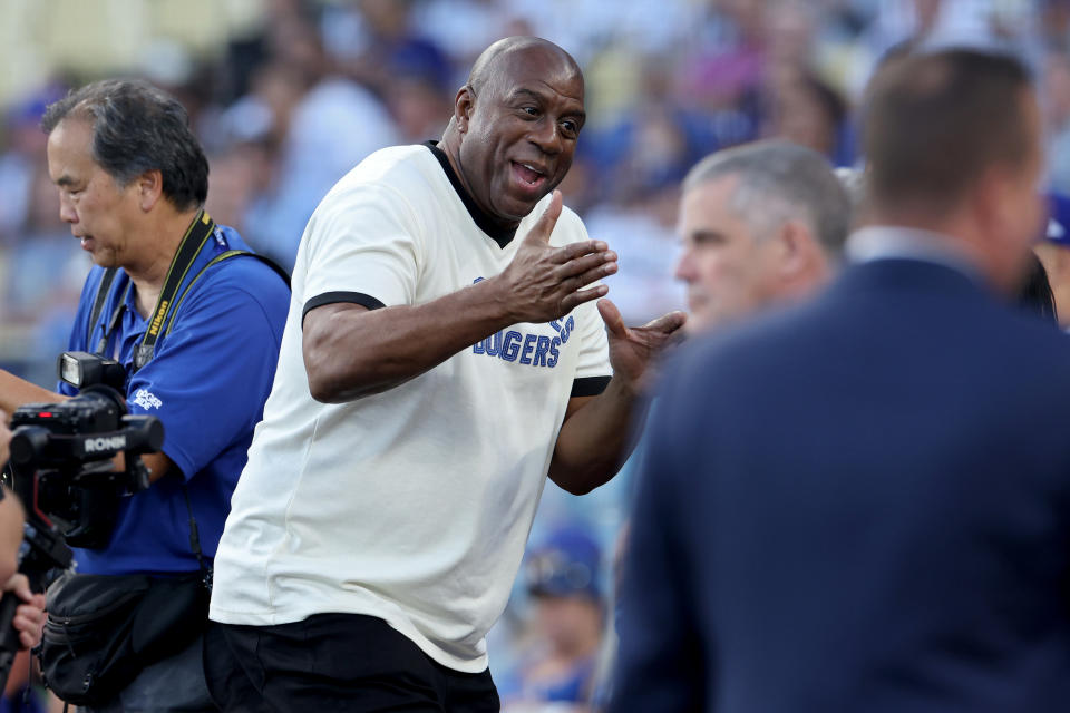 LOS ANGELES, CALIFORNIA - OCTOBER 07: Magic Johnson attends a pre-game ceremony before Game One of the Division Series between the Arizona Diamondbacks and the Los Angeles Dodgers at Dodger Stadium on October 07, 2023 in Los Angeles, California. (Photo by Harry How/Getty Images)