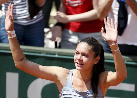Andreea Mitu of Romania celebrates after beating Francesca Schiavone of Italy during their women's singles match at the French Open tennis tournament at the Roland Garros stadium in Paris, France, May 30, 2015. REUTERS/Vincent Kessler