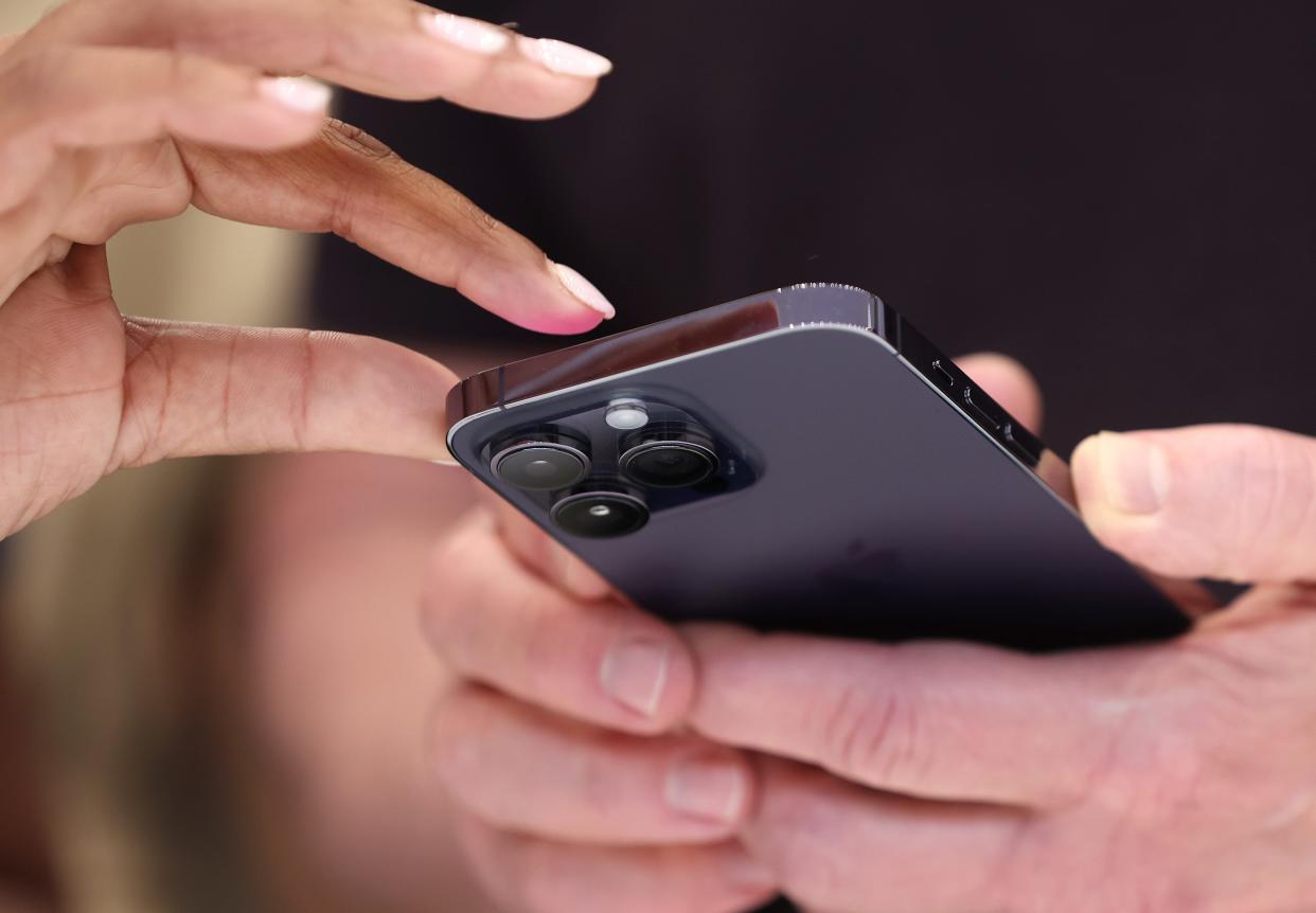 A person is pictured holding an iPhone. A group of Oregon lawmakers hopes to pass the nation’s strongest “right-to-repair” bill during next month’s legislative session.