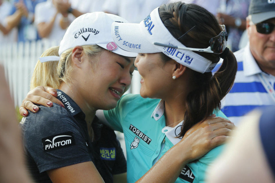 Jeongeun Lee6 of South Korea, weeps while embracing So Yeon Ryu of South Korea, after the final round of the U.S. Women's Open golf tournament, Sunday, June 2, 2019, in Charleston, S.C. Lee6 won the tournament.(AP Photo/Steve Helber)