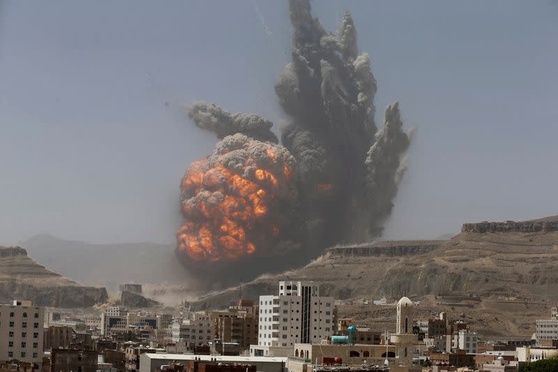FILE PHOTO: Smoke rises during an air strike on an army weapons depot on a mountain overlooking Yemen's capital Sanaa