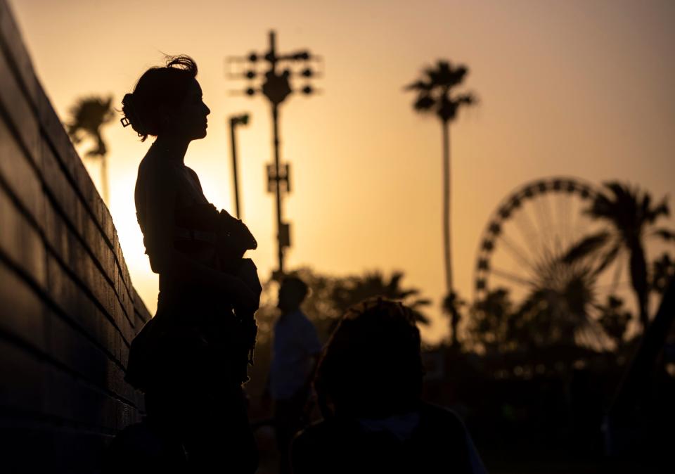 A festivalgoer stands and waits for Tinashe's set next to the Mojave tent during the Coachella Valley Music and Arts Festival in Indio, Calif., Friday.