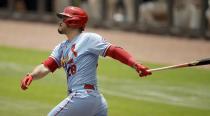 CORRECTS THE DAY AND DATE TO SUNDAY, JUNE 20, NOT SATURDAY, JUNE 19 - St. Louis Cardinals' Nolan Arenado swings for a two-run home run in the first inning of the first baseball game of a double header Sunday, June 20, 2021, in Atlanta. (AP Photo/Ben Margot)
