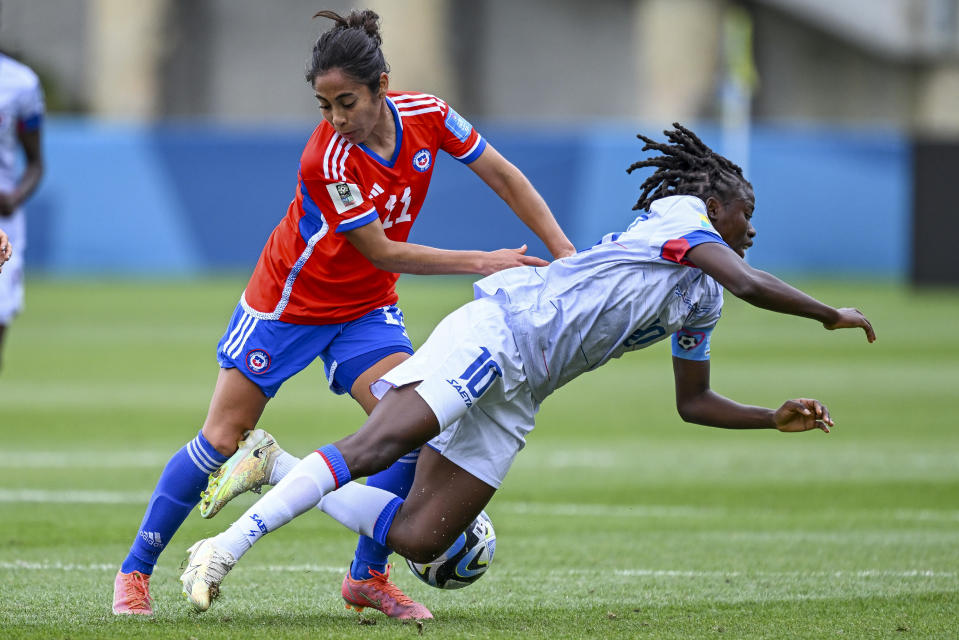 Yessenia Lopez of Chile and Nerilia Mondesir of Haiti compete for the ball during their FIFA women's World Cup qualifier in Auckland, New Zealand, Wednesday, Feb. 22, 2023. (Andrew Cornaga/Photosport via AP)