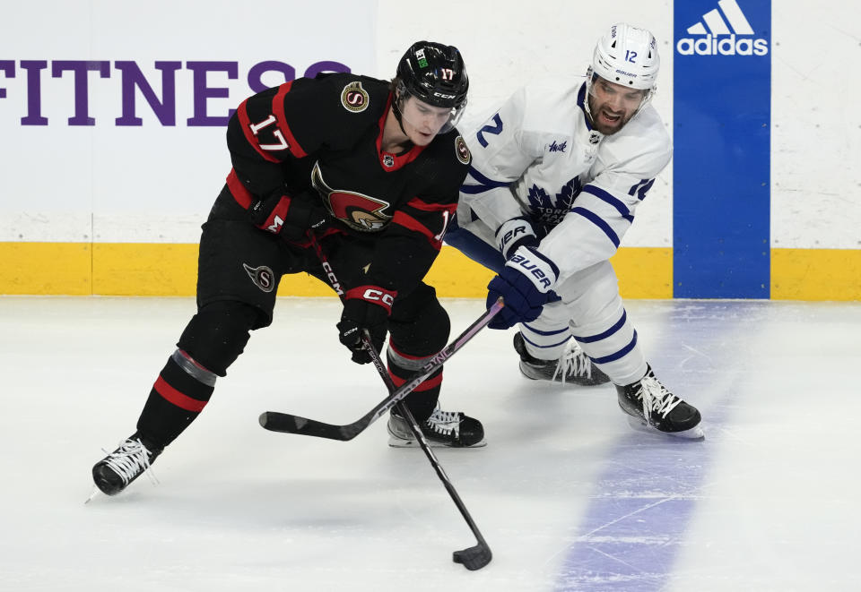 Toronto Maple Leafs center Zach Aston-Reese (12) reacts as Ottawa Senators center Ridly Greig steals the puck from him at the blue line during the first period of an NHL hockey game, Saturday, March 18, 2023 in Ottawa, Ontario. (Adrian Wyld/The Canadian Press via AP)