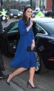 <p>For her first engagement of the year, The Duchess of Cambridge steps out in London wearing a royal blue coat dress by Eponine and navy suede clutch and heels.</p>