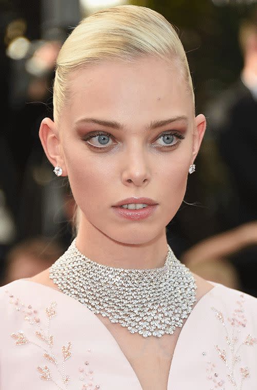 The Russian model put on a bit of a show on the carpet of the opening ceremony of the 68th annual Cannes Film Festival. Impeccable is her shiny blonde slick do and tight-curled ponytail while her little pink pout is glossy and her eye shadow glowing with shades of pink, silver and mauve. What a stunner.