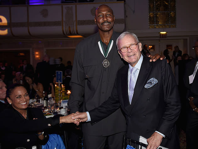 Karl Malone and Tom Brokaw talk up the Greatest Generation, which included Adam Keefe. (Getty Images)