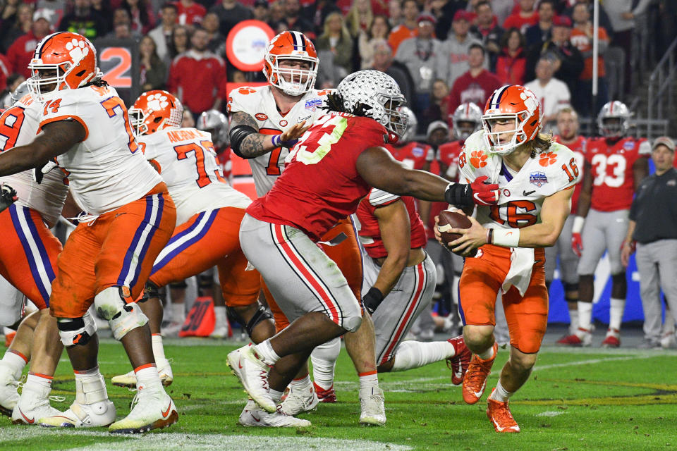 Clemson Tigers QB Trevor Lawrence (16) is pressured by Ohio State Buckeyes DT DaVon Hamilton (53) during the 2019 Fiesta Bowl. (Brian Rothmuller/Icon Sportswire via Getty Images)