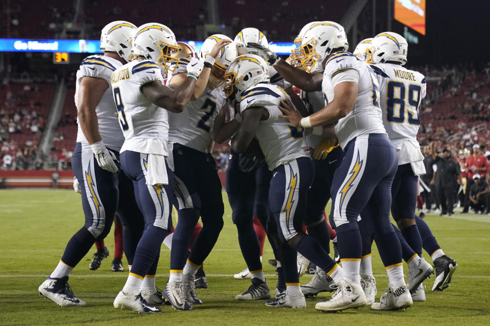 The Los Angeles Chargers celebrate a touchdown in last year's preseason. (AP Photo/Tony Avelar)