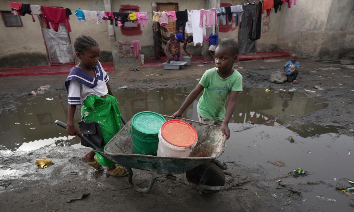 <span>Children fetch water using a wheelbarrow in Lilanda township in Lusaka. The rains failed in February and there is little prospect of saving the maize crop.</span><span>Photograph: Tsvangirayi Mukwazhi/AP</span>