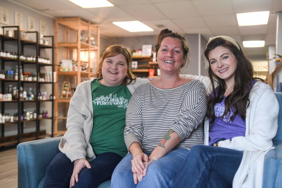 ABĒCA Naturals owner Ashley Murphy (center) poses for a portrait with employees Suzanne Fanning (left) and Kaitlyn Harrison (right) in the store in North Augusta, S.C., on Tuesday, Feb. 27, 2024.