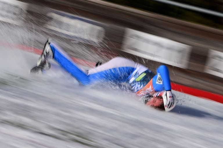 TOPSHOT - Norway’s Daniel Andre Tande falls to the ground during the FIS Ski Jumping World Cup Flying Hill Individual competition in Planica on March 25, 2021. (Photo by Jure MAKOVEC / AFP)