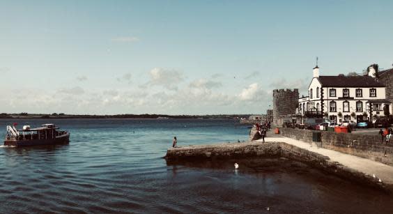 Postcard pretty: the waterfront in Caernarfon, with Anglesey in the background (Simon Calder)