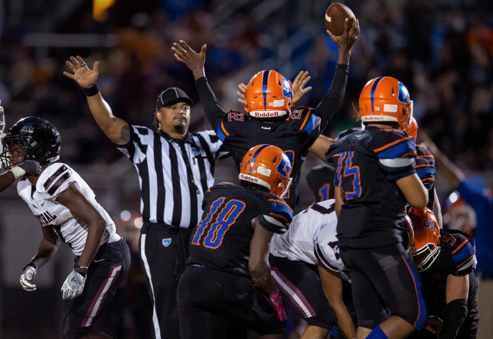 Palm Beach Gardens Demetrious Williamson (22) celebrates a fumble recovery against Palm Beach Central at Palm Beach Gardens, Florida on October 22, 2021. 