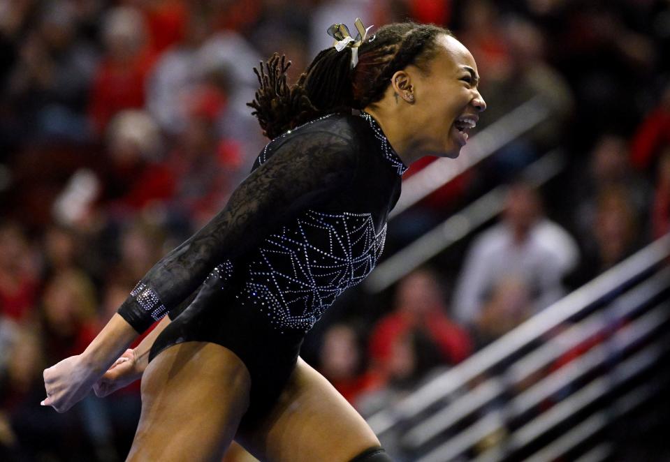 Utah State’s Amari Evans, celebrates after her floor routine as BYU, Utah, SUU and Utah State meet in the Rio Tinto Best of Utah Gymnastics competition at the Maverick Center in West Valley City on Monday, Jan. 15, 2024. | Scott G Winterton, Deseret News