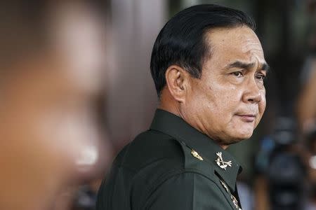 Thai Army chief General Prayuth Chan-ocha arrives before a meeting with high ranking officials at the Army Club after the army declared martial law nationwide to restore order, in Bangkok May 20, 2014. REUTERS/Athit Perawongmetha