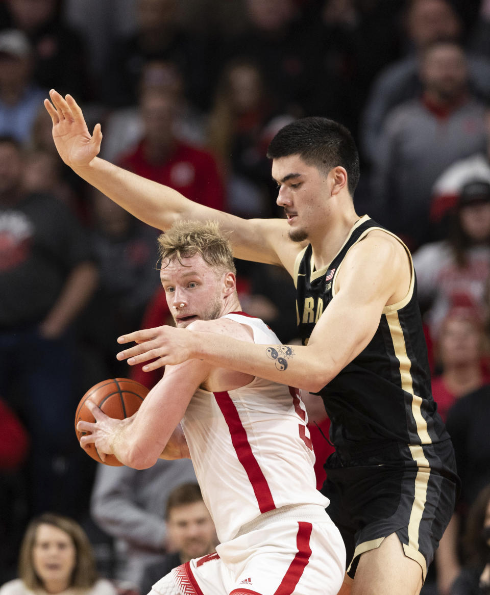 Nebraska's Rienk Mast, left, is defended by Purdue's Zach Edey during the second half of an NCAA college basketball game Tuesday, Jan. 9, 2024, in Lincoln, Neb. Nebraska won 88-72. (AP Photo/Rebecca S. Gratz)