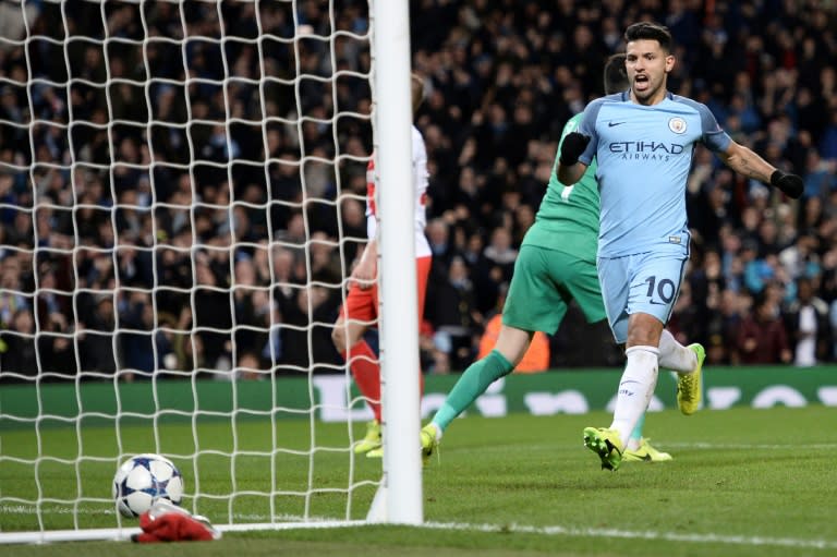 Manchester City's striker Sergio Aguero (R) celebrates scoring their second goal during the UEFA Champions League Round of 16 first-leg football match between Manchester City and Monaco at the Etihad Stadium in Manchester, on February 21, 2017