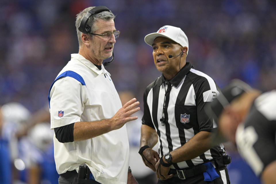 Indianapolis Colts head coach Frank Reich talks with referee Tra Blake (33) in the first half of an NFL preseason preseason football game against the Tampa Bay Buccaneers in Indianapolis, Saturday, Aug. 27, 2022. (AP Photo/Doug McSchooler)