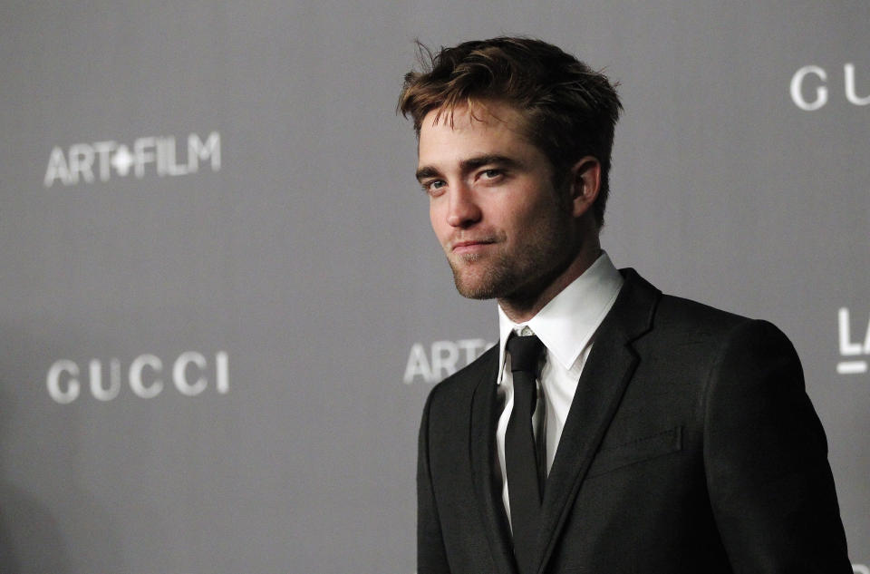 Actor Robert Pattinson poses at the Los Angeles County Museum of Art (LACMA) 2012 Art + Film Gala in Los Angeles, California October 27, 2012. REUTERS/Mario Anzuoni (UNITED STATES - Tags: ENTERTAINMENT)