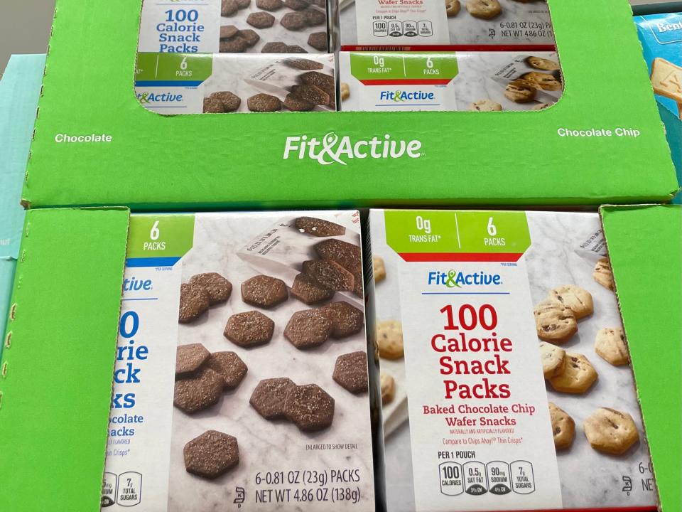 Boxes of 100 calorie snacks stacked on shelf at Aldi