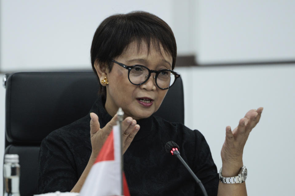 Indonesian Foreign Minister Retno Marsudi gestures as she speaks during a bilateral meeting with Chinese Foreign Minister Wang Yi in Jakarta, Indonesia, Thursday, April 18, 2024. The Chinese and Indonesian foreign ministers called for an immediate and lasting cease-fire in Gaza after a meeting in Jakarta on Thursday, condemning the humanitarian costs of the ongoing war that has killed tens of thousands of Palestinians. (Yasuyoshi Chiba/Pool Photo via AP)